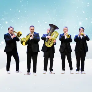 Five men in suits play brass instruments against a snowy, wintry blue background with white sparkling lights.