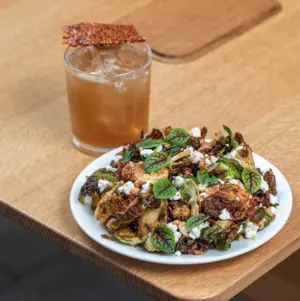 A plate of food and a drink.