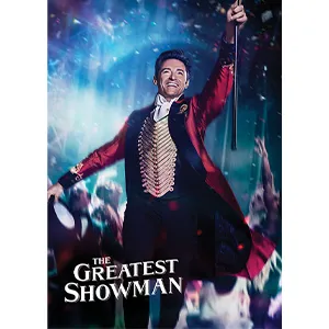 A man in a red coat holds a cane and hat, smiling on stage. Text reads “The Greatest Showman.”.